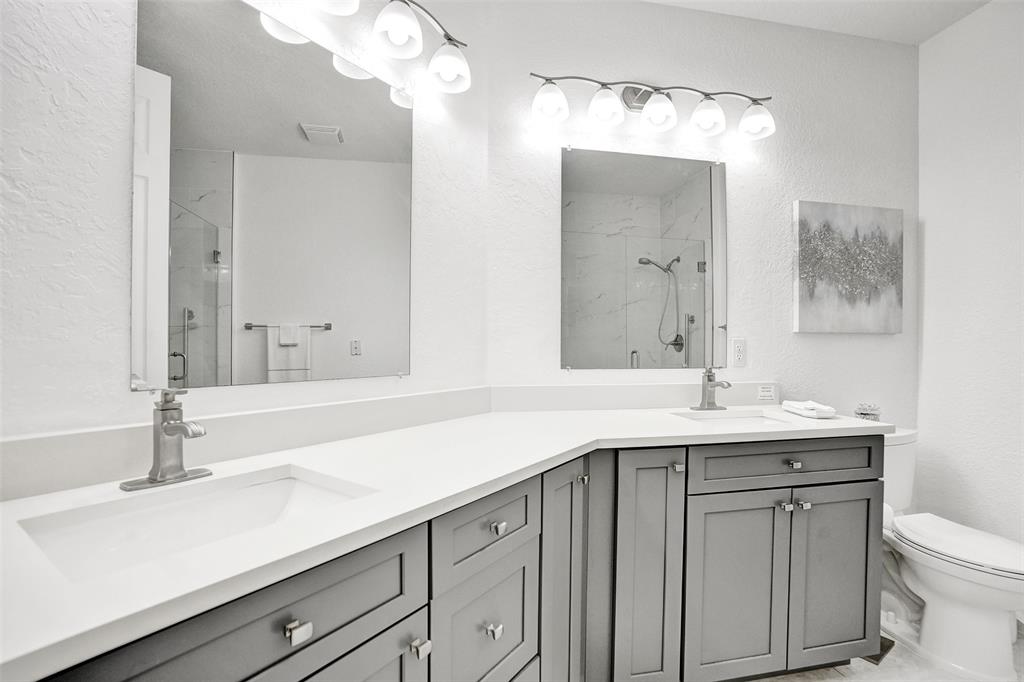 7967 Exeter Boulevard East, Unit 203 Tamarac, FL 33321 - Photo 16 of 42 a bathroom with a sink and a mirror
