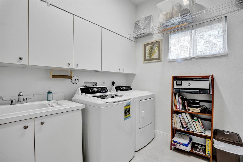 7967 Exeter Boulevard East, Unit 203 Tamarac, FL 33321 - Photo 24 of 42 *** SEPARATE LAUNDRY ROOM WITH FULL SIZE WASHER/DRYER, SINK & LOTS OF STORAGE SPACE ***