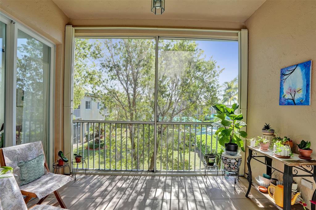 7967 Exeter Boulevard East, Unit 203 Tamarac, FL 33321 - Photo 25 of 42 *** ACCORDION SHUTTERS ON THE TERRACE SIMPLIFY STORM & HURRICANE PROTECTION ***