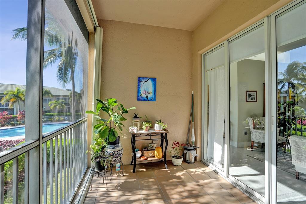 7967 Exeter Boulevard East, Unit 203 Tamarac, FL 33321 - Photo 29 of 42 *** LOVELY POOL VIEWS FROM THE TERRACE ***