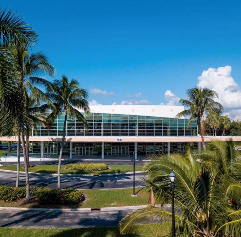 7967 Exeter Boulevard East, Unit 203 Tamarac, FL 33321 - Photo 39 of 42 a view of a swimming pool with a yard