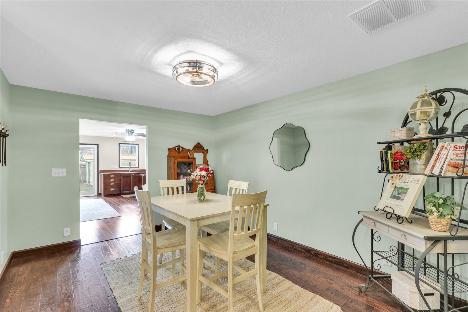 703 East Washington Street Tolono, IL 61880 - Photo 16 of 38 a view of a dining room with furniture and wooden floor