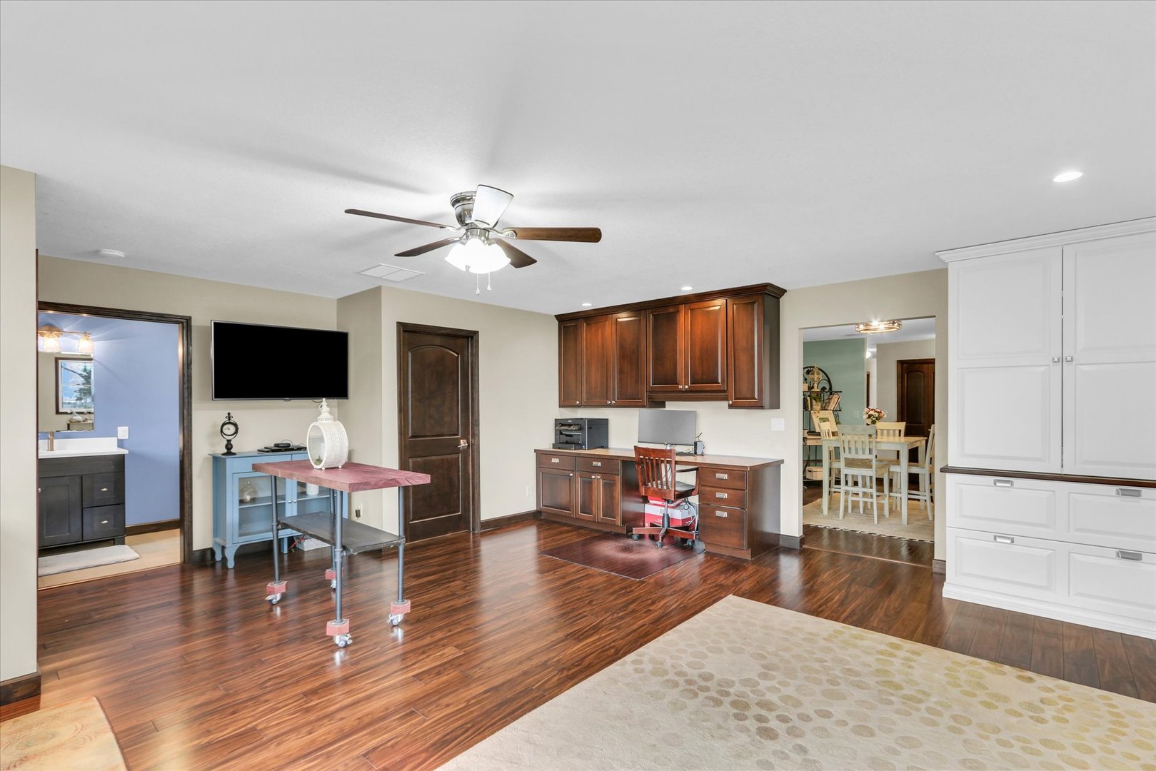 703 East Washington Street Tolono, IL 61880 - Photo 20 of 38 a living room with furniture wooden floor and a flat screen tv