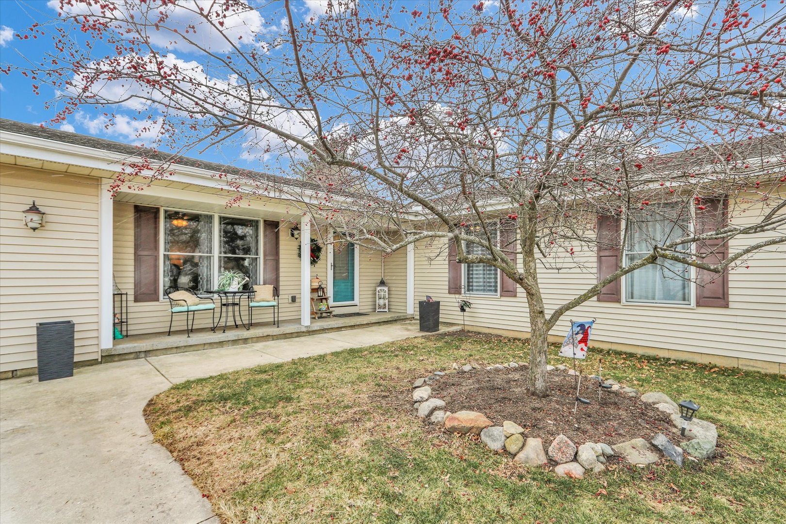 703 East Washington Street Tolono, IL 61880 - Photo 2 of 38 a view of a house with backyard porch and sitting area