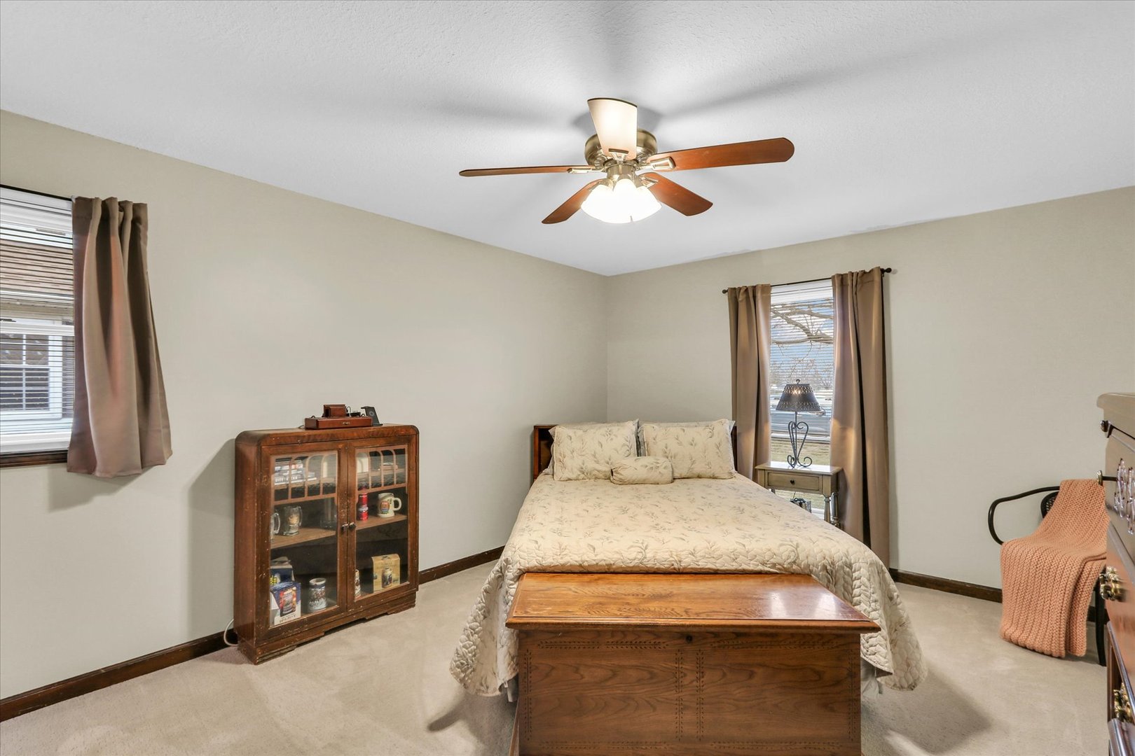 703 East Washington Street Tolono, IL 61880 - Photo 25 of 38 a bedroom with a bed and a chandelier