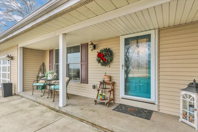 a view of an entryway with wooden door