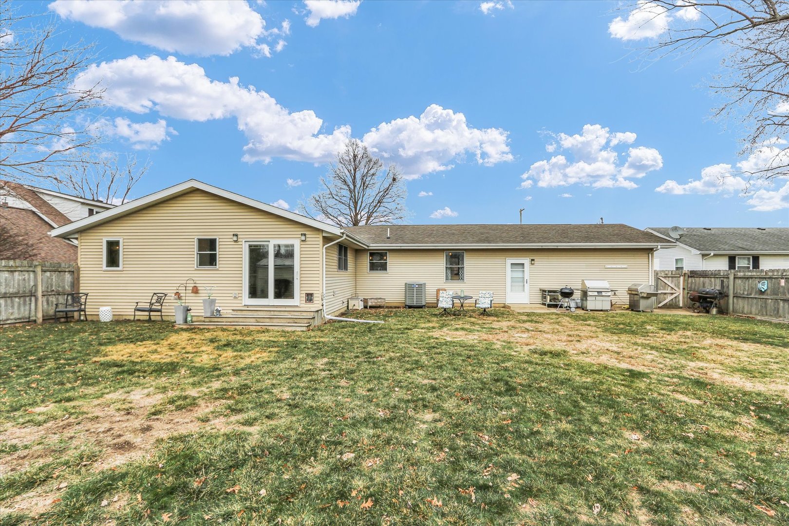 703 East Washington Street Tolono, IL 61880 - Photo 34 of 38 a view of a house with a backyard