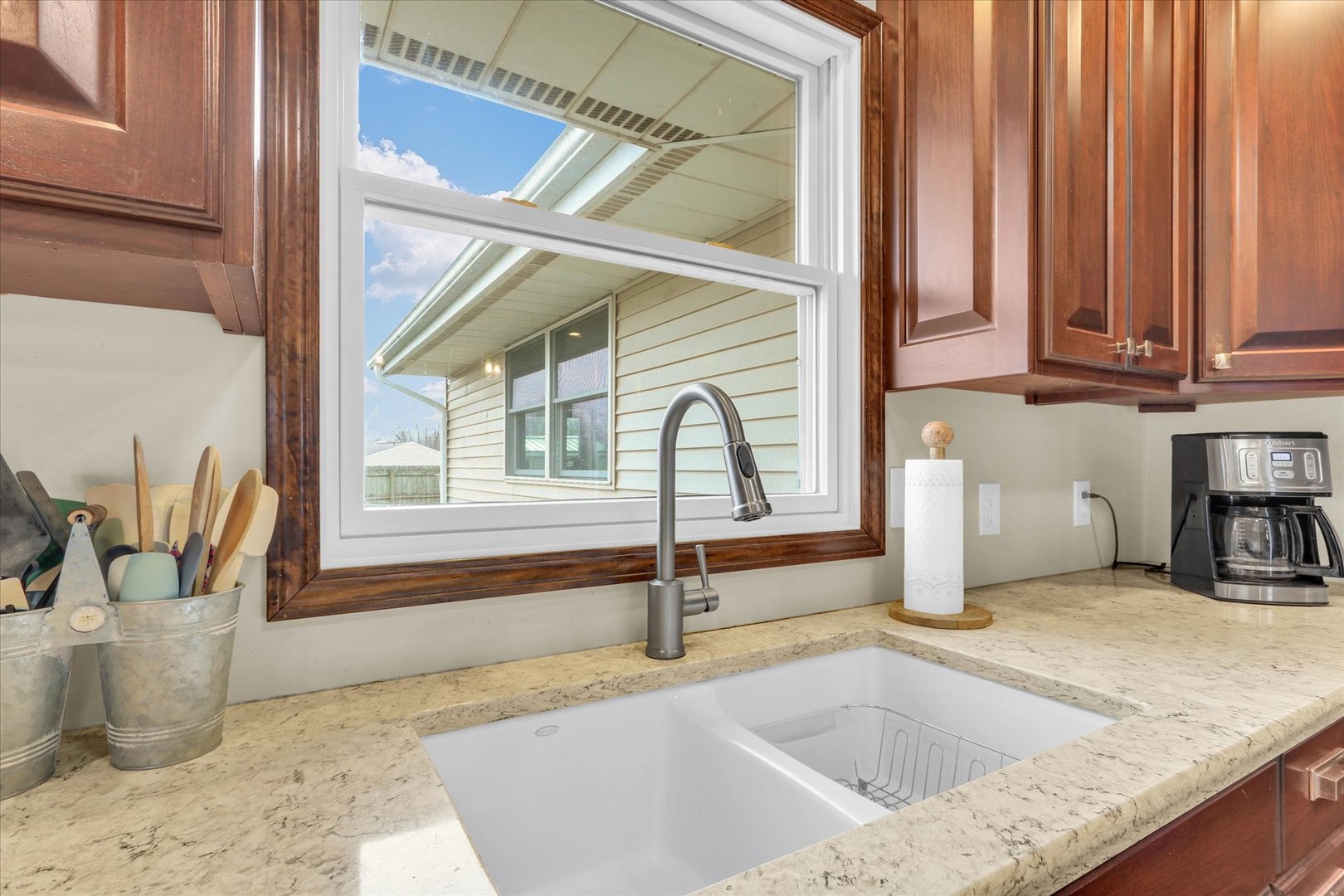 703 East Washington Street Tolono, IL 61880 - Photo 9 of 38 a kitchen with a sink and large window