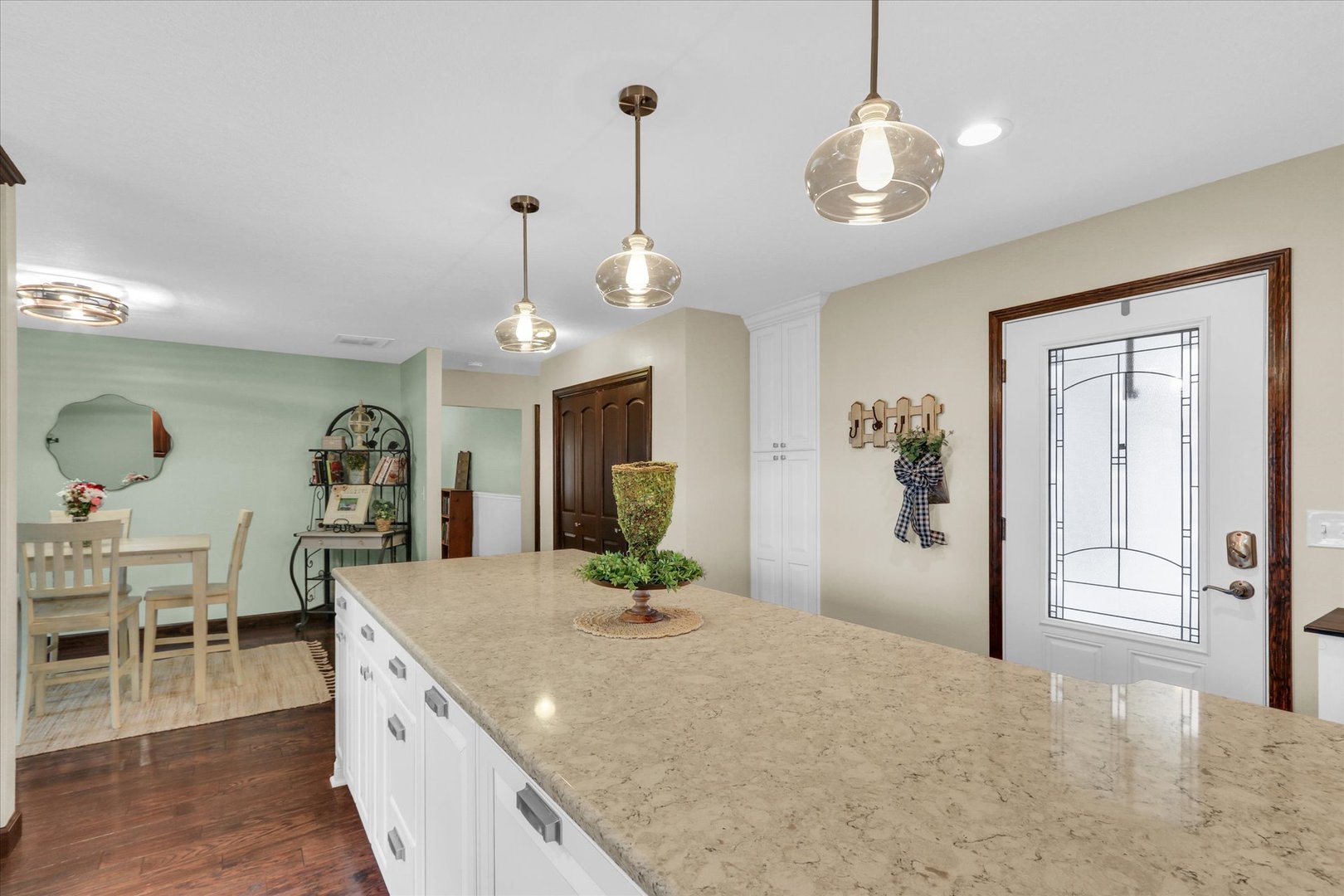 703 East Washington Street Tolono, IL 61880 - Photo 10 of 38 a living room with granite countertop furniture a fireplace and chandelier