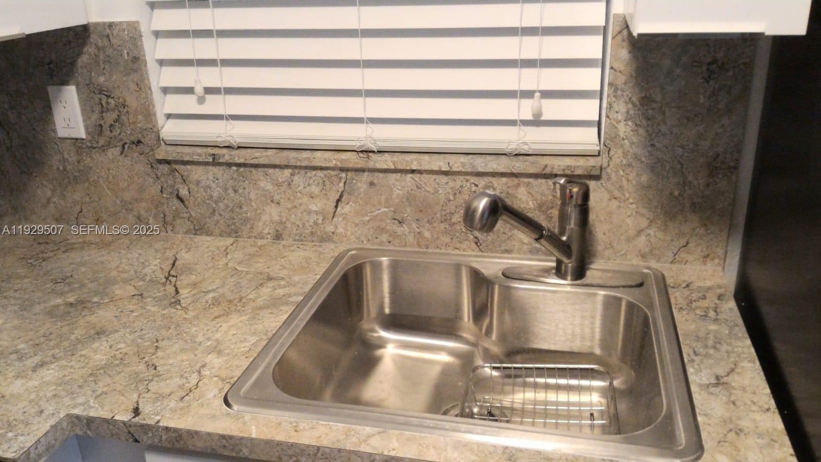 1755 Northeast 116th Road, Unit 15 North Miami, FL 33181 - Photo 7 of 9 a close view of sink