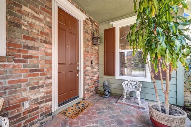 a bathroom with a granite countertop sink a toilet and a mirror