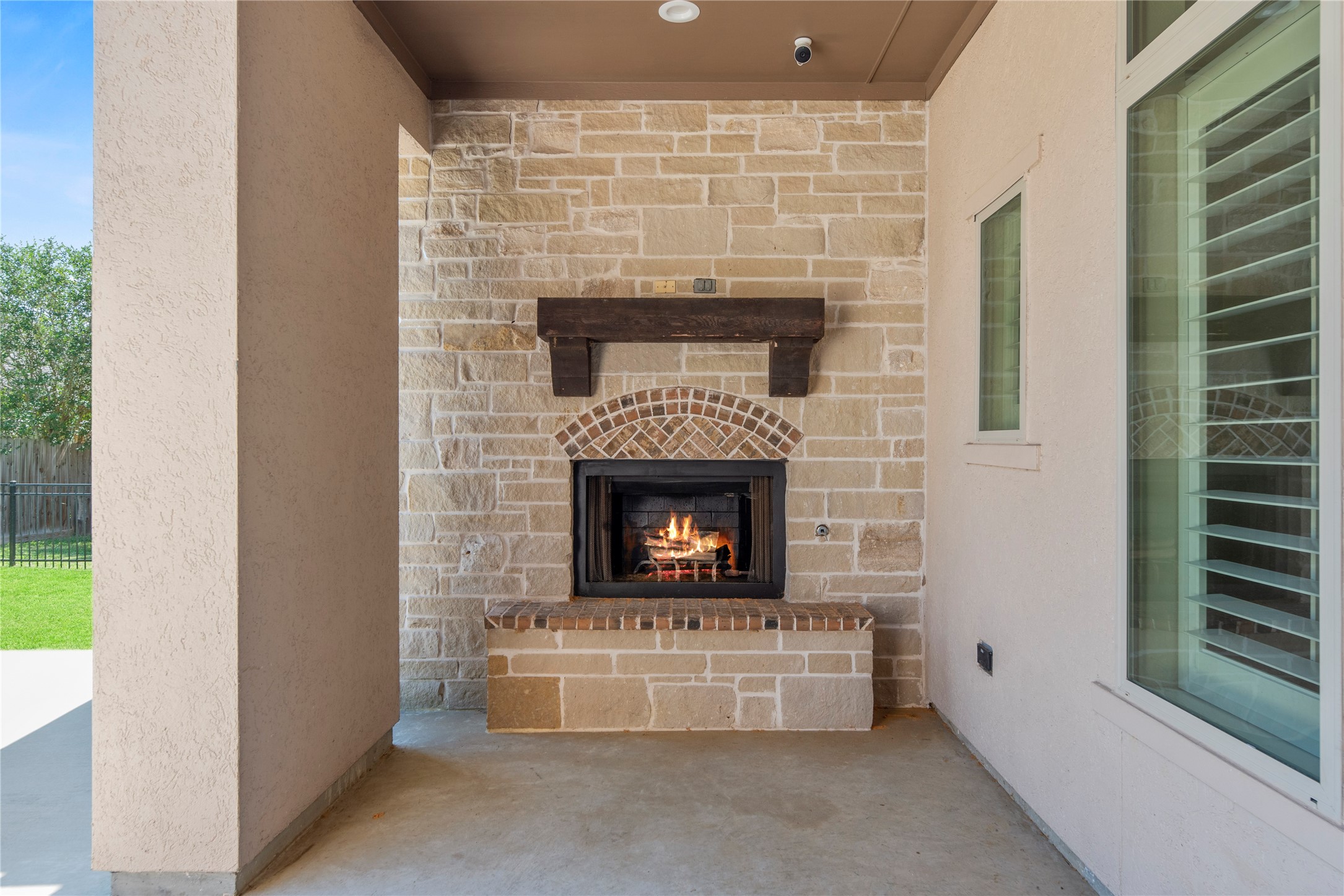 28226 South Firethorne Road Katy, TX 77494 - Photo 32 of 39 The covered patio is anchored by a majestic stone-accented fireplace, perfectly plumbed for gas to create the ultimate year-round entertaining experience.