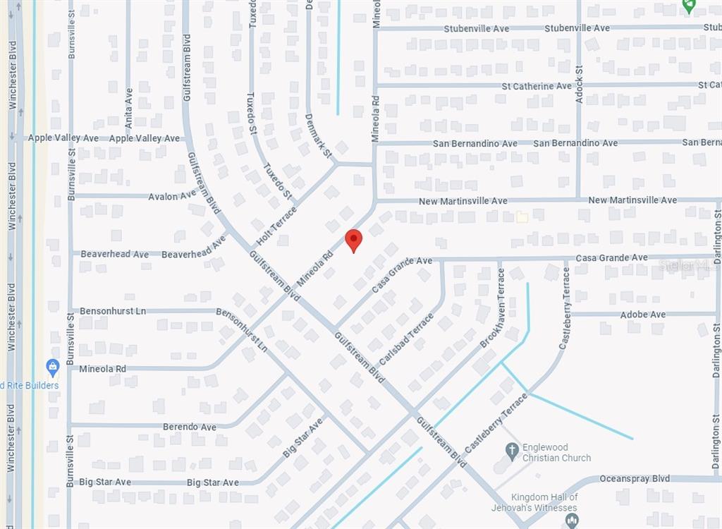 7146 Mineola Road Englewood, FL 34224 - Photo 5 of 7 a picture of a room with a white walls and a window