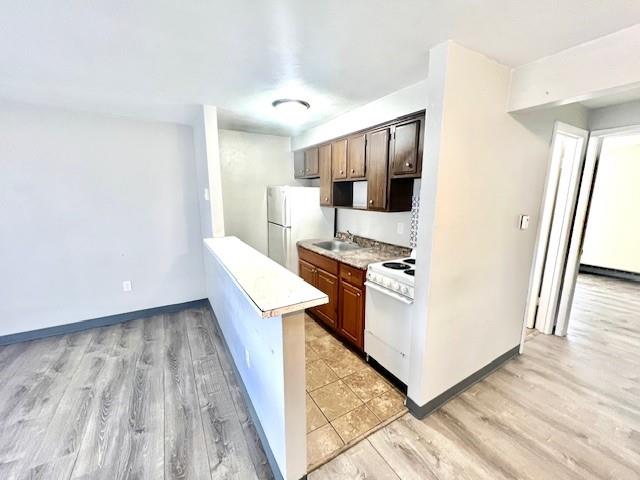201 Union Street California, PA 15419 - Photo 4 of 9 a hallway view with wooden floor and electronic appliances