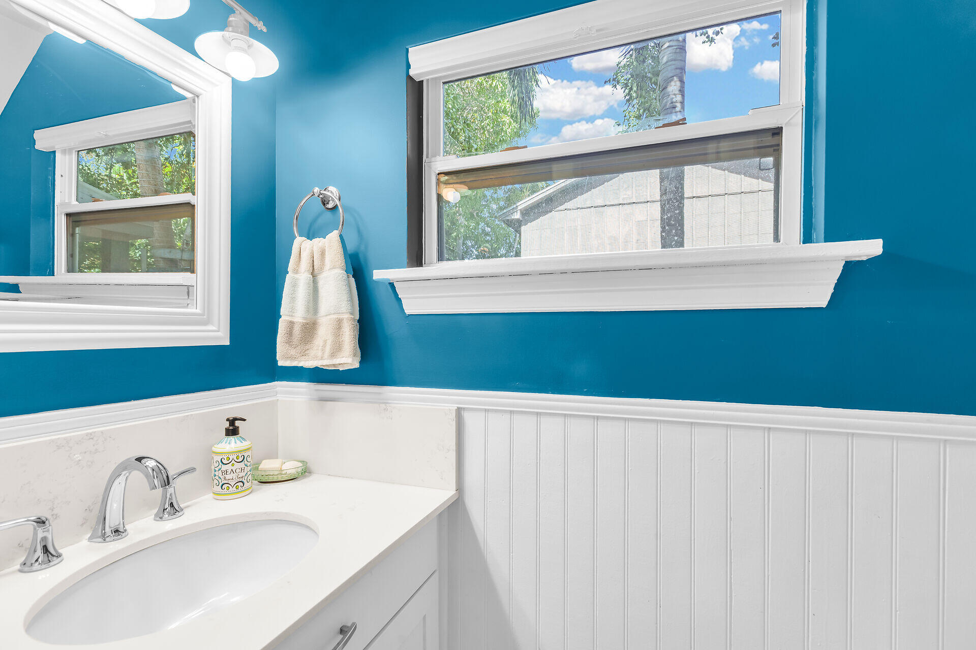 a bathroom with a sink and a window