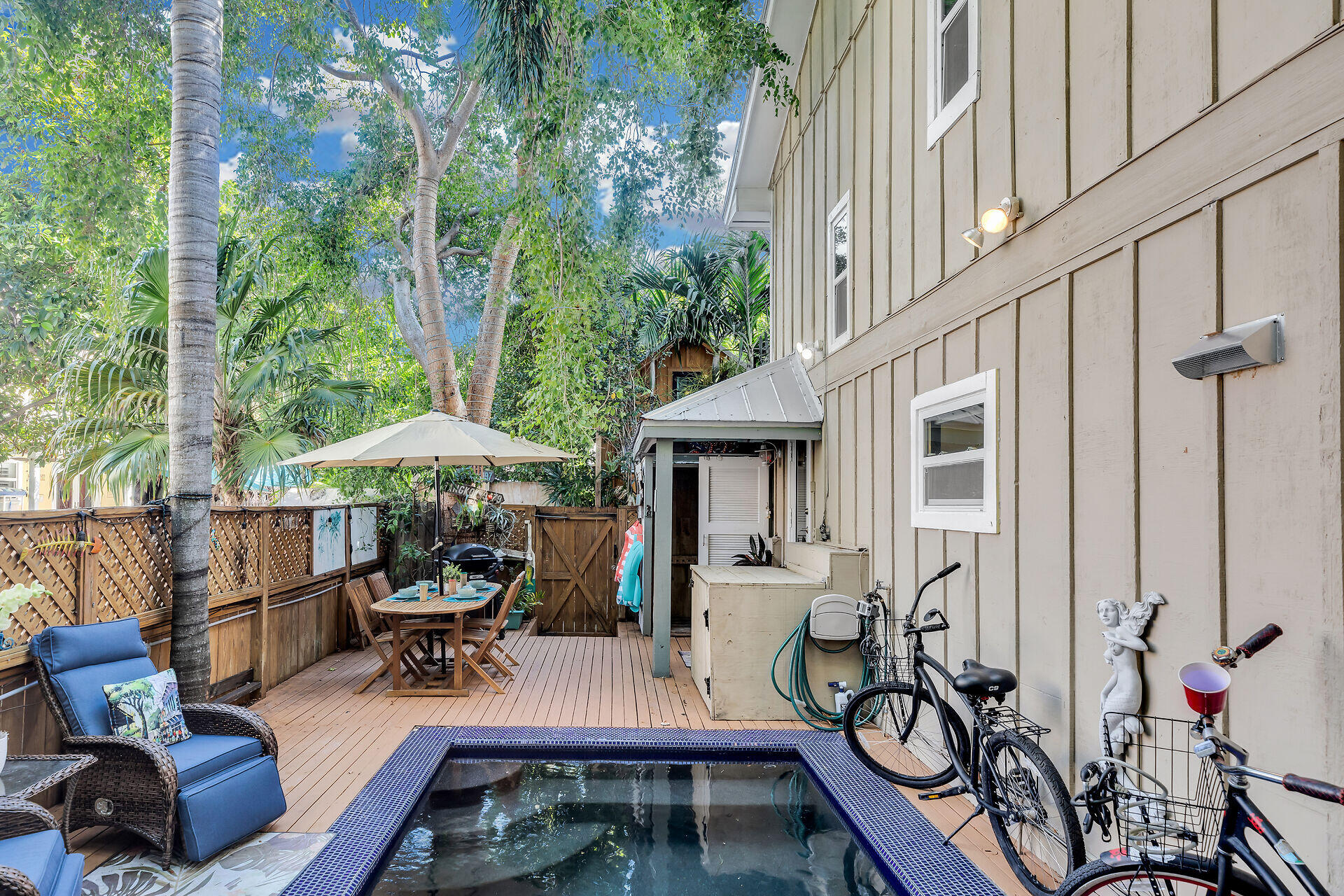 808 Virginia Street, Unit 4 Key West, FL 33040 - Photo 14 of 32 a view of a patio with furniture and table