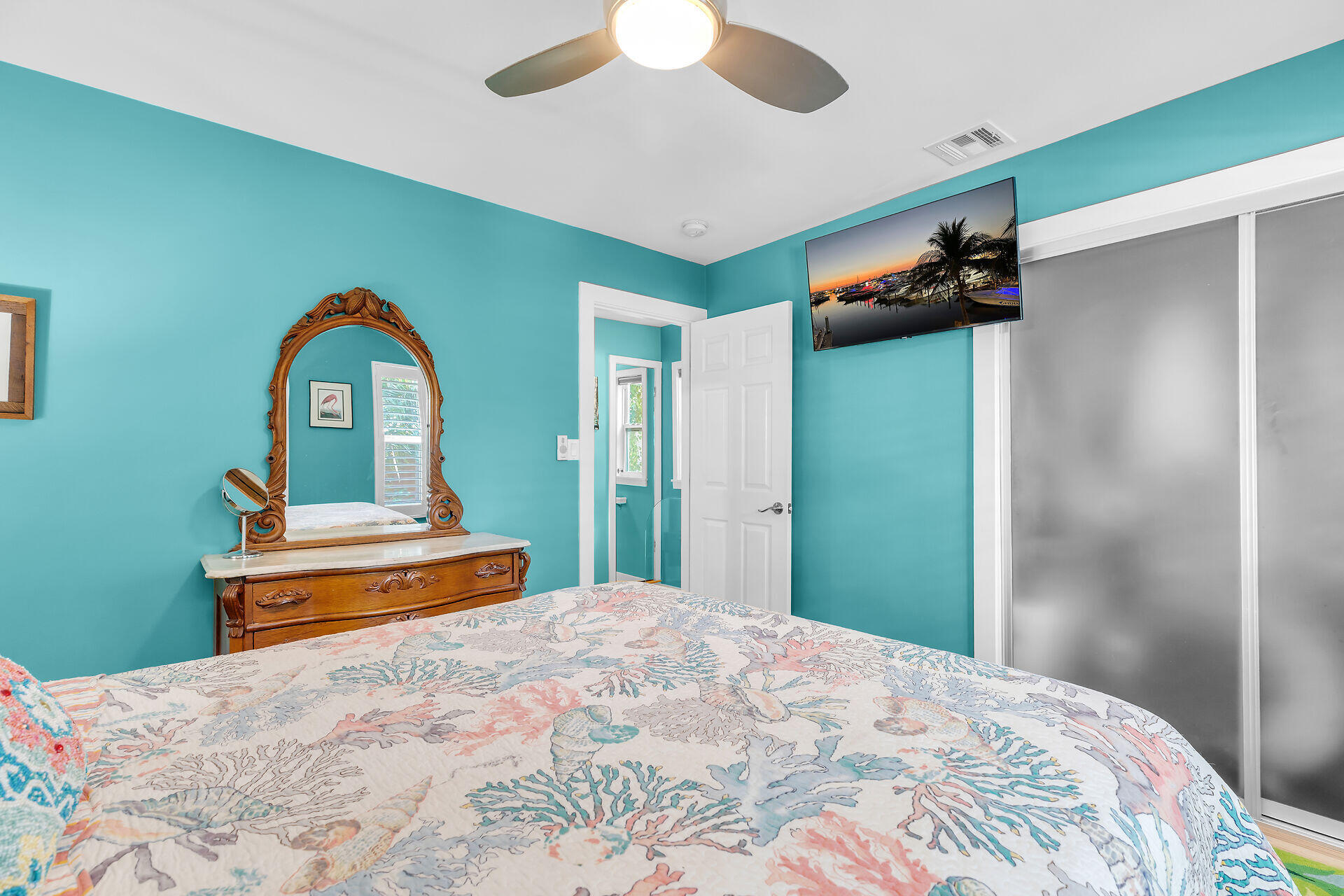 808 Virginia Street, Unit 4 Key West, FL 33040 - Photo 22 of 32 a bedroom with a bed and a dresser