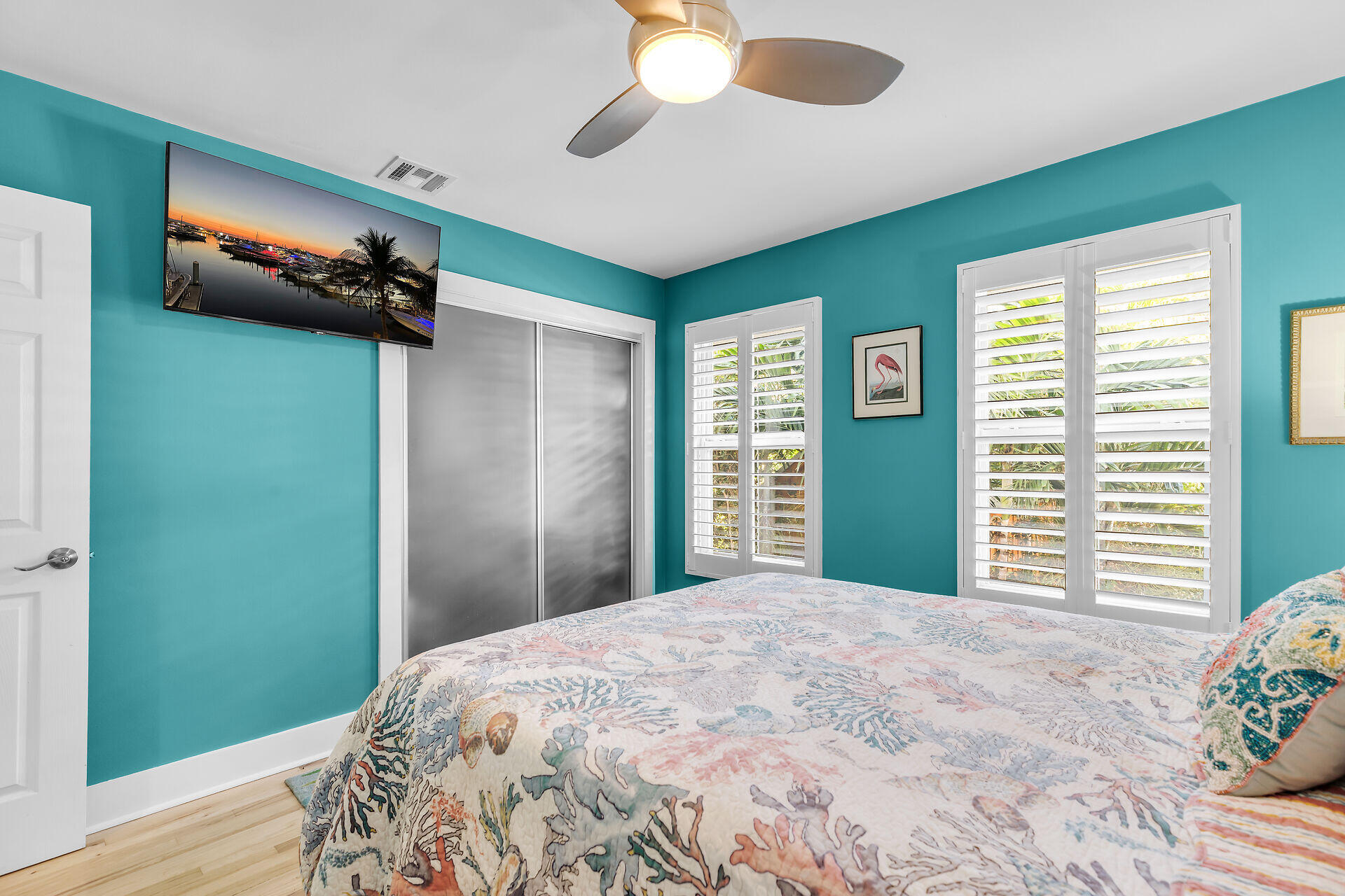 808 Virginia Street, Unit 4 Key West, FL 33040 - Photo 23 of 32 a bedroom with a bed and a chandelier