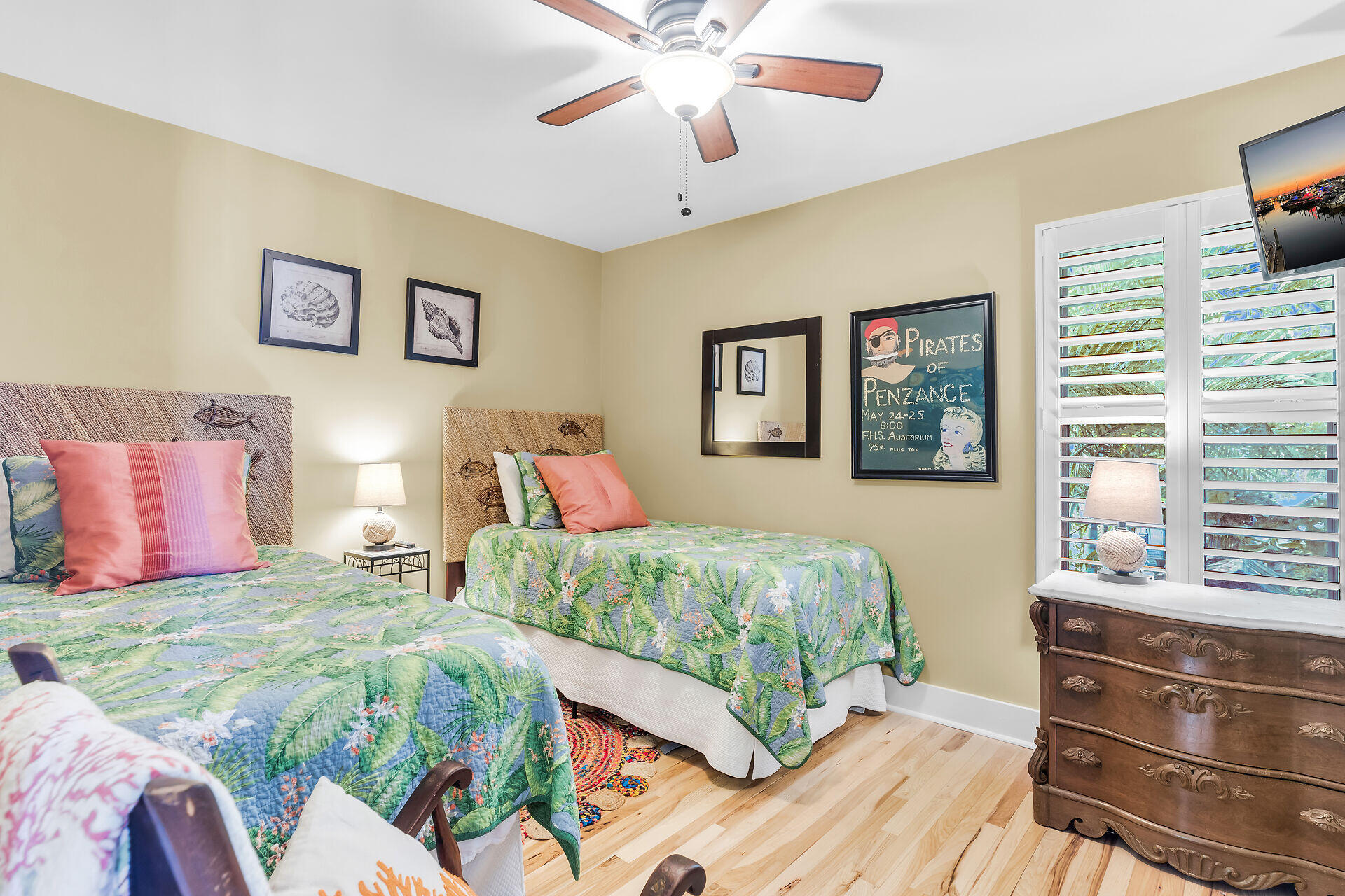 808 Virginia Street, Unit 4 Key West, FL 33040 - Photo 26 of 32 a bedroom with a bed and wooden floor