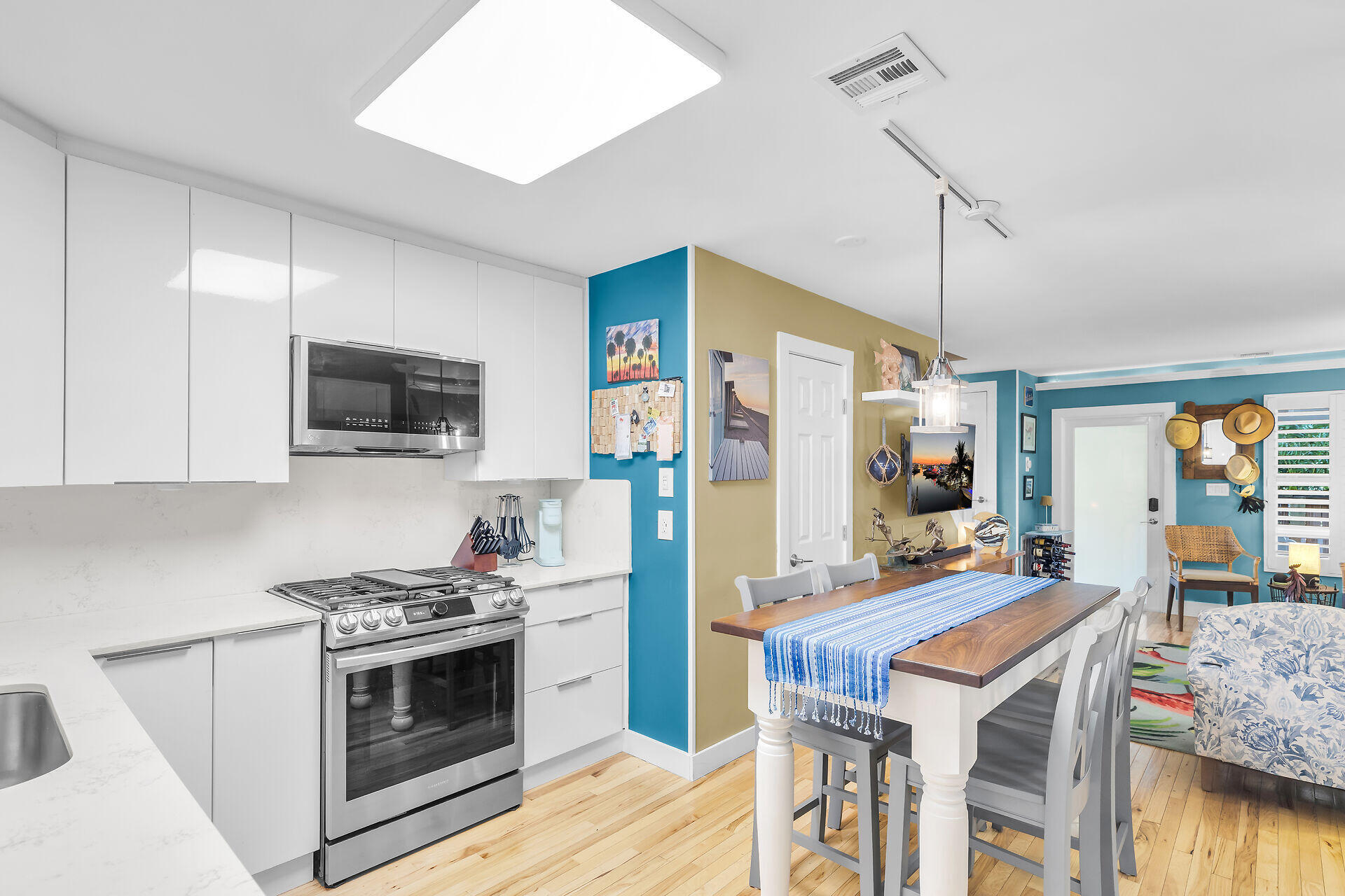 808 Virginia Street, Unit 4 Key West, FL 33040 - Photo 30 of 32 a kitchen with stainless steel appliances granite countertop a stove refrigerator and microwave