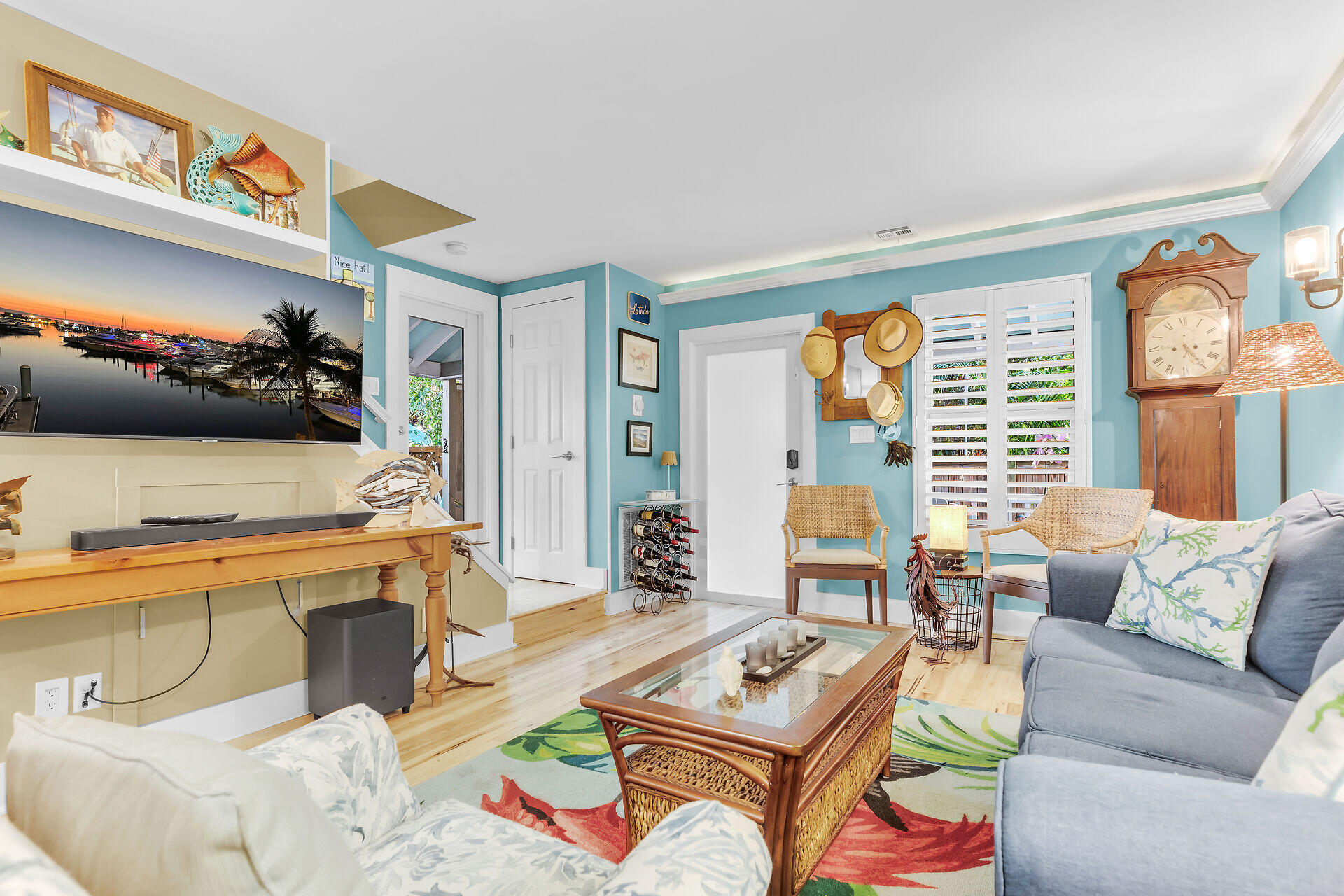 808 Virginia Street, Unit 4 Key West, FL 33040 - Photo 7 of 32 a living room with furniture and a flat screen tv