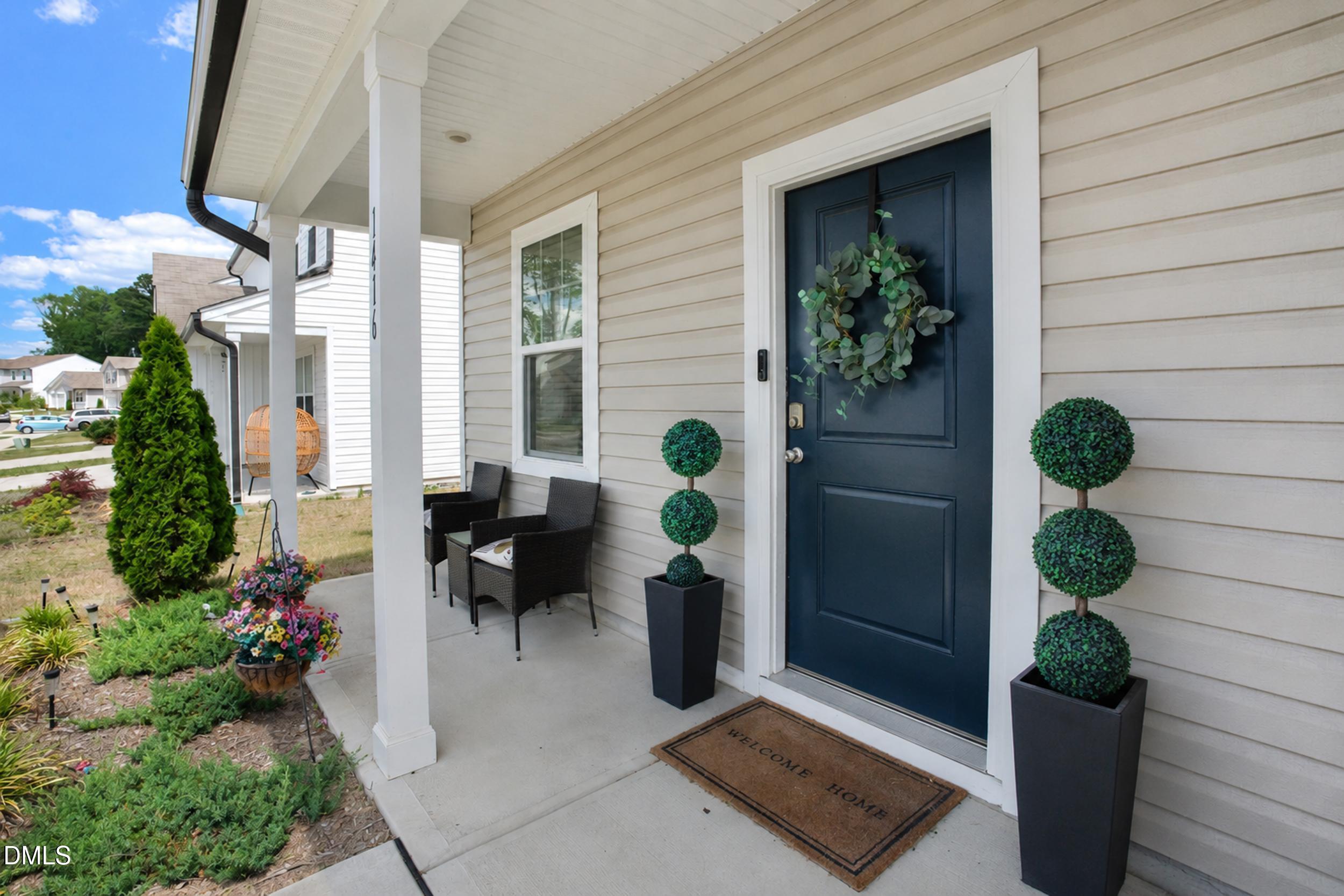 1416 Heron Pond Street Raleigh, NC 27604 - Photo 25 of 25 a view of a door with a potted plant