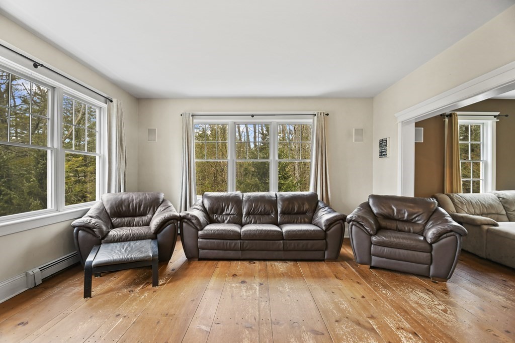 277 Secret Lake Road Athol, MA 01331 - Photo 11 of 36 a living room with furniture and a large window