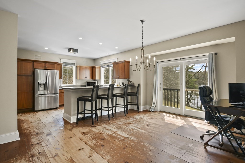 277 Secret Lake Road Athol, MA 01331 - Photo 12 of 36 a view of a a dining room with furniture window and wooden floor