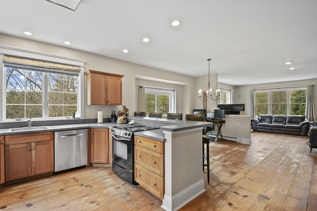 277 Secret Lake Road Athol, MA 01331 - Photo 17 of 36 a kitchen with lots of counter top space and living room