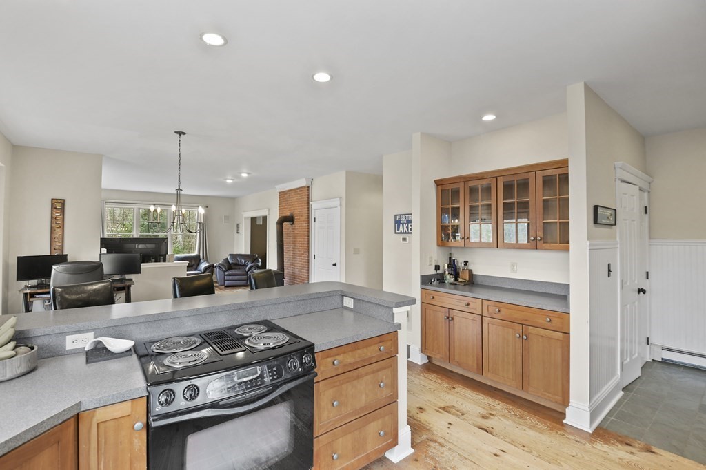 277 Secret Lake Road Athol, MA 01331 - Photo 18 of 36 a kitchen with stainless steel appliances granite countertop a stove and a sink