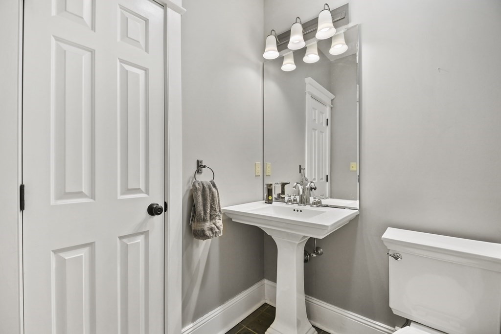 277 Secret Lake Road Athol, MA 01331 - Photo 20 of 36 a bathroom with a sink a mirror and a toilet