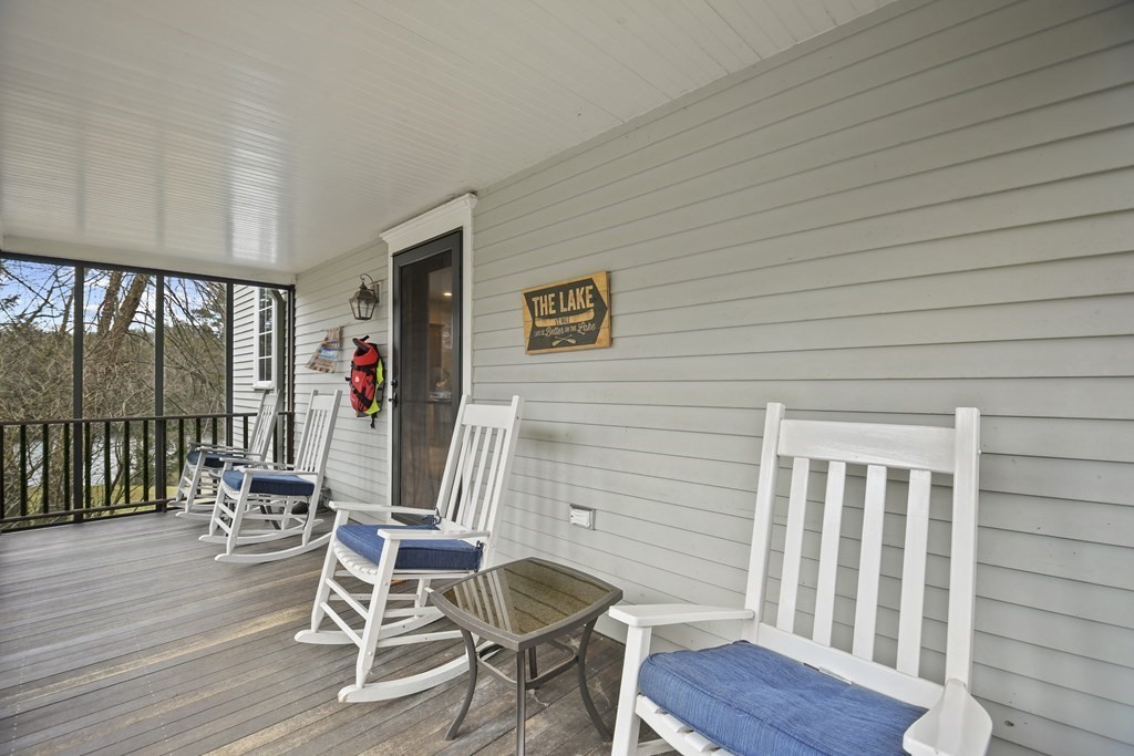 277 Secret Lake Road Athol, MA 01331 - Photo 21 of 36 a view of a chairs and table in a balcony