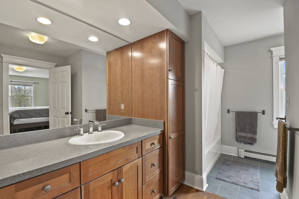 277 Secret Lake Road Athol, MA 01331 - Photo 23 of 36 a bathroom with a sink double vanity granite and a shower