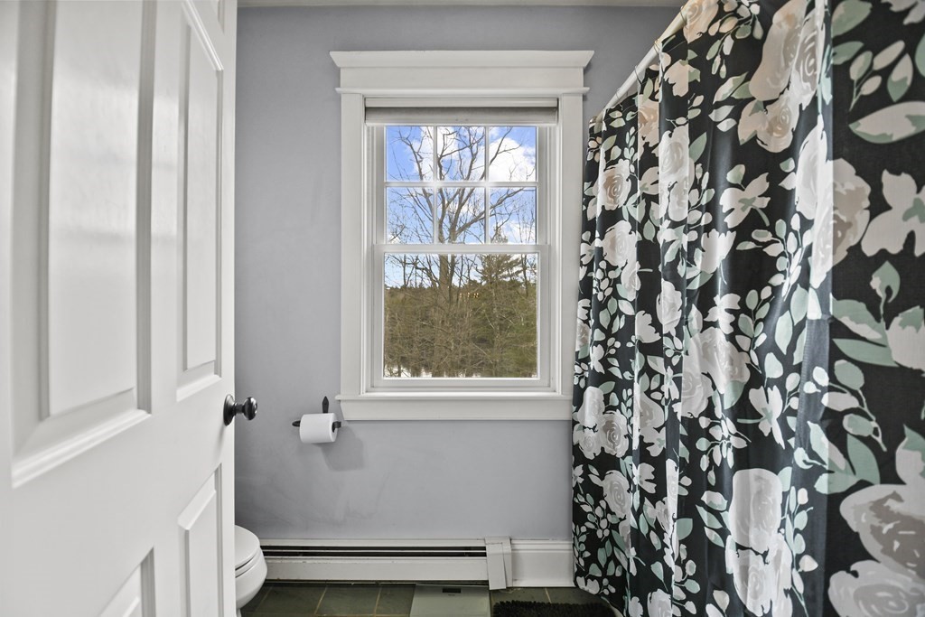 277 Secret Lake Road Athol, MA 01331 - Photo 27 of 36 a bathroom with a window and a shower