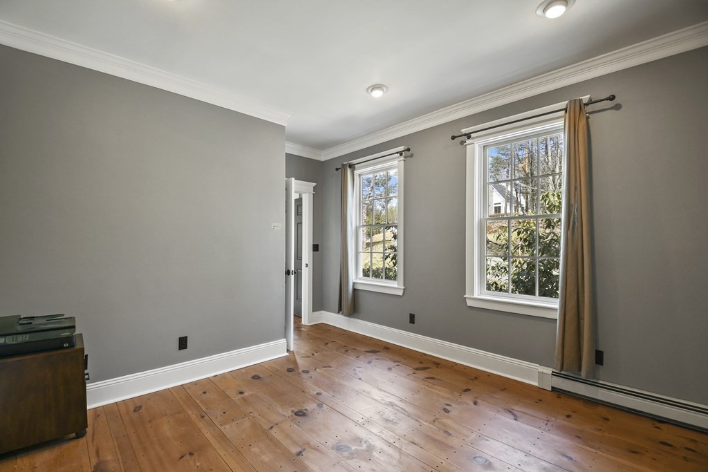 277 Secret Lake Road Athol, MA 01331 - Photo 6 of 36 a view of an empty room with wooden floor and a window