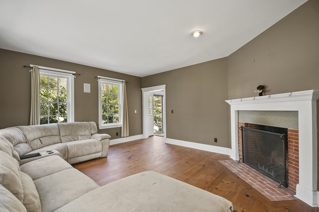 277 Secret Lake Road Athol, MA 01331 - Photo 8 of 36 a living room with furniture and a fireplace