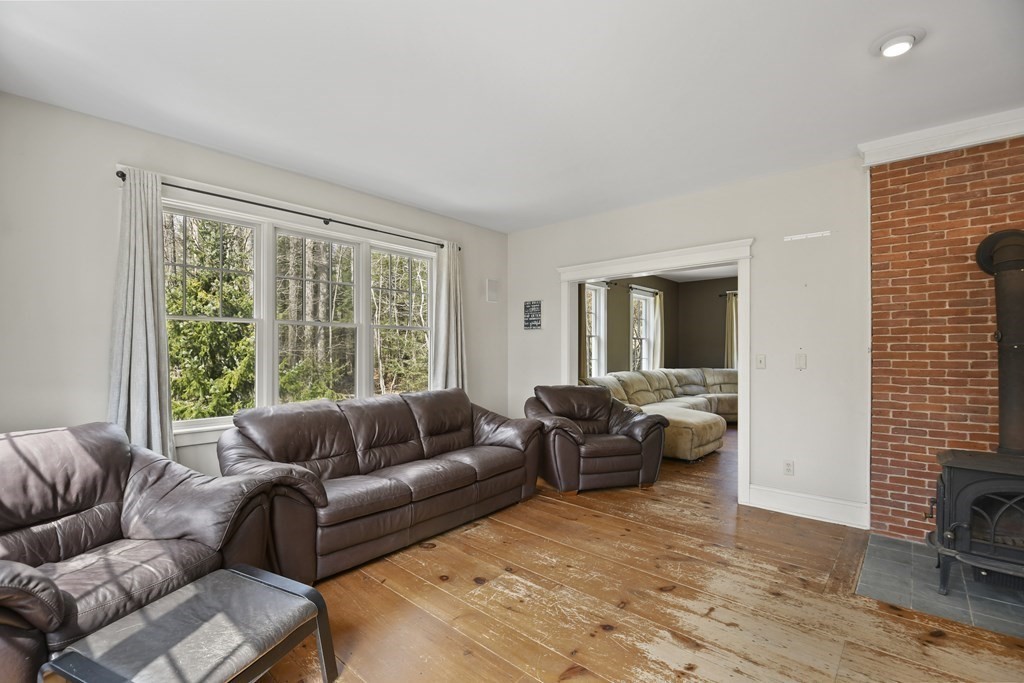 277 Secret Lake Road Athol, MA 01331 - Photo 10 of 36 a living room with furniture and a large window