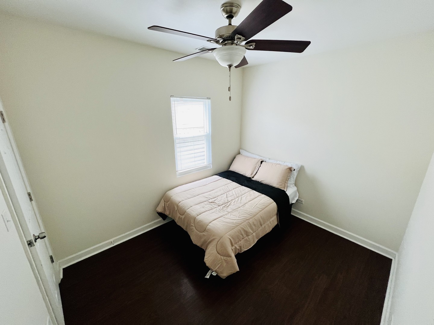1821 West Cullerton Street, Unit 2 Chicago, IL 60608 - Photo 4 of 10 a bedroom with a bed and a ceiling fan