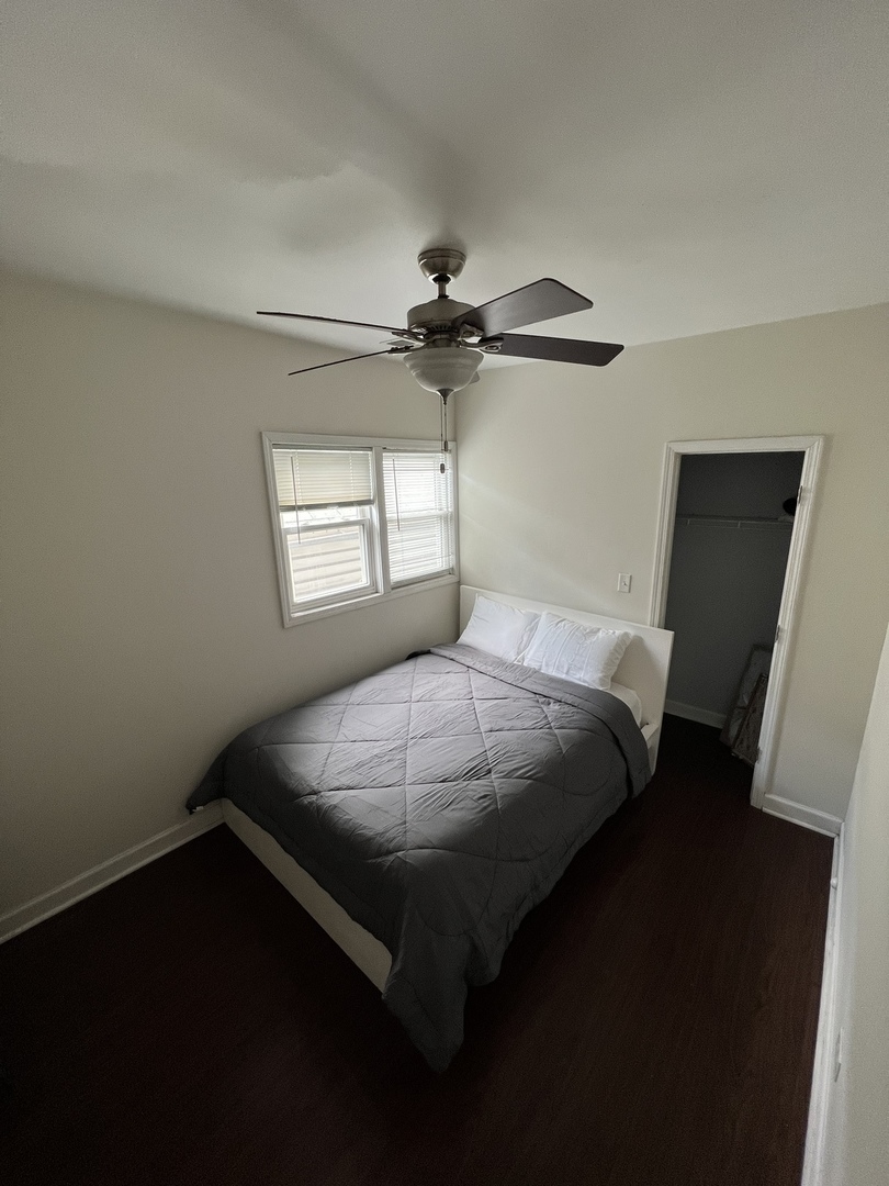 1821 West Cullerton Street, Unit 2 Chicago, IL 60608 - Photo 6 of 10 a bed sitting in a bedroom next to a window