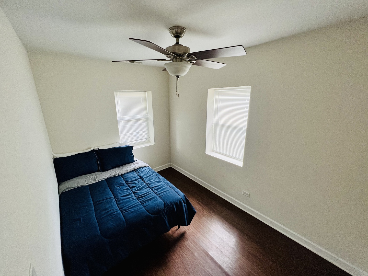 1821 West Cullerton Street, Unit 2 Chicago, IL 60608 - Photo 7 of 10 a bedroom with a bed and a window