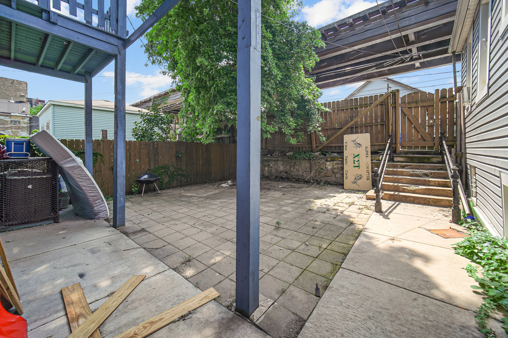 1821 West Cullerton Street, Unit 2 Chicago, IL 60608 - Photo 10 of 10 a view of a house with backyard and trees