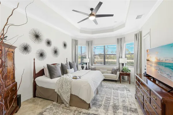 a bedroom with a large bed and a window