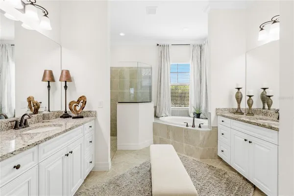a spacious bathroom with sinks double vanity and a mirror