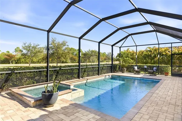 a view of swimming pool with a patio