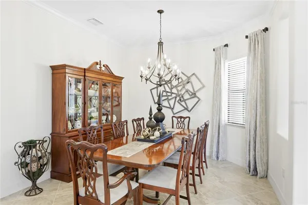 a view of a dining room with furniture and window