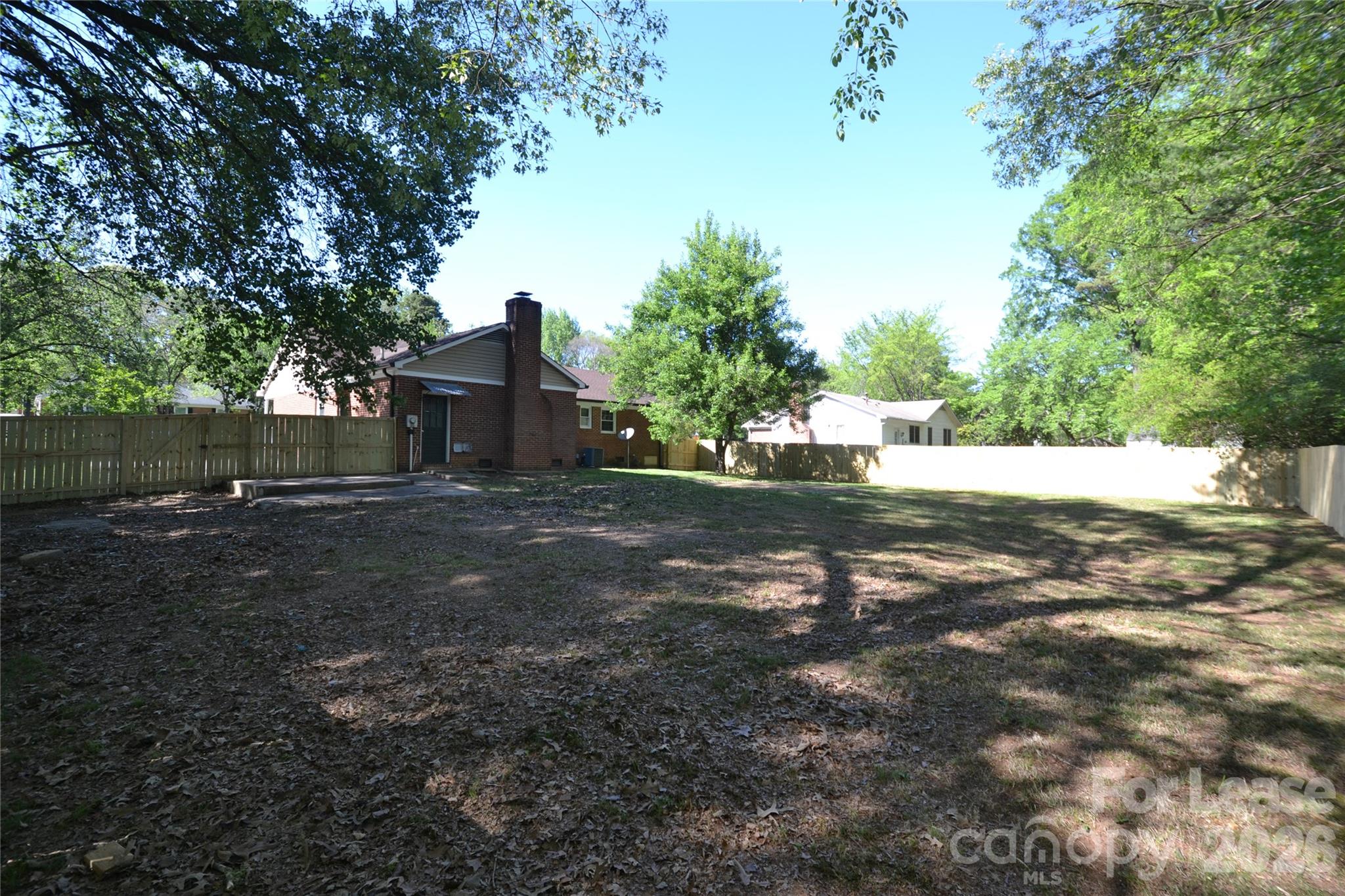 1422 Thermal Road Charlotte, NC 28212 - Photo 38 of 40 a view of yard with large tree and wooden fence