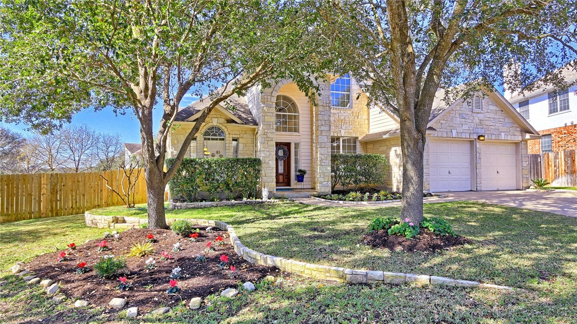 5705 Bexley Court Austin, TX 78739 - Photo 1 of 1 a front view of a house with a yard
