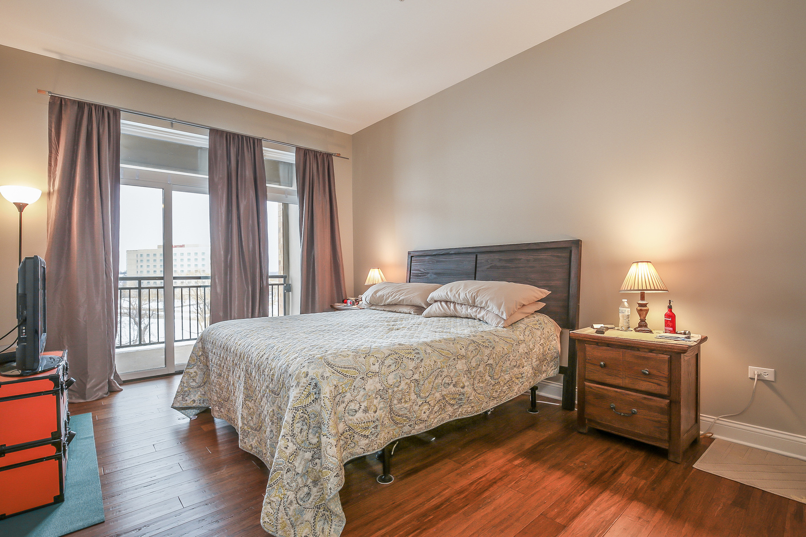 1000 Village Center Drive, Unit 312 Burr Ridge, IL 60527 - Photo 13 of 25 a bed sitting in a bedroom next to a window