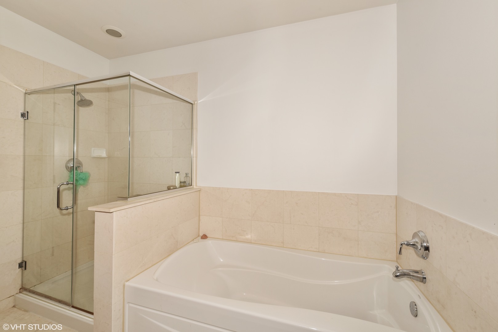 1000 Village Center Drive, Unit 312 Burr Ridge, IL 60527 - Photo 15 of 25 a bathroom with a bathtub and a shower
