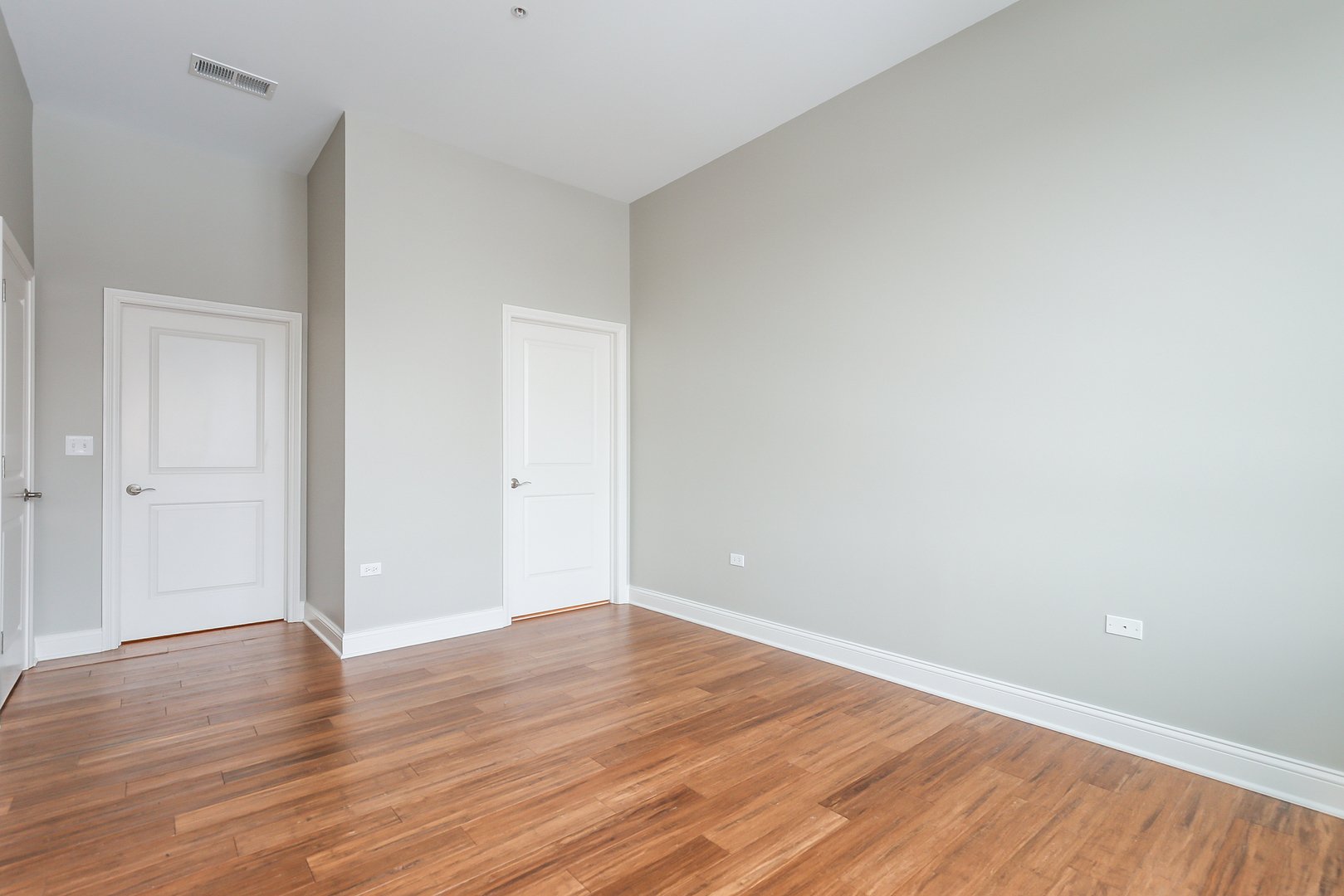 1000 Village Center Drive, Unit 312 Burr Ridge, IL 60527 - Photo 17 of 25 a view of an empty room with wooden floor